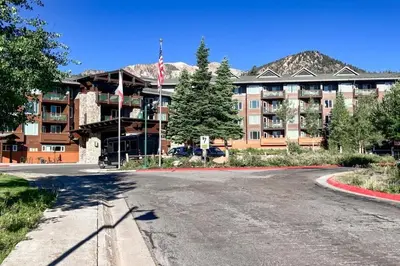 an empty parking lot in front of a large building at Juniper Springs 444 in Mammoth Lakes