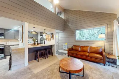 a living room with a couch and a table at La Residence 8 in Mammoth Lakes