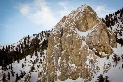 a large rocky mountain with snow on it at Westin 617 in Mammoth Lakes