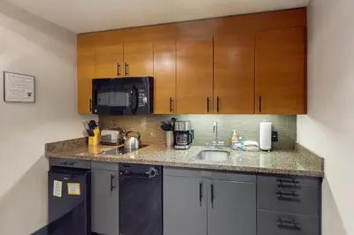 a kitchen with a sink and a microwave at Westin 617 in Mammoth Lakes