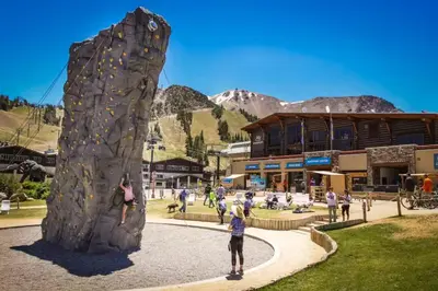 a group of people playing on a rock wall at Westin 617 in Mammoth Lakes