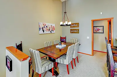 a dining room with a wooden table and chairs at Snowcreek 791 in Mammoth Lakes