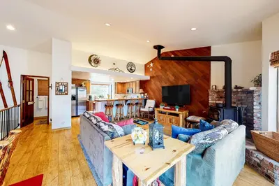 a living room with a couch and a table at Forest Creek 12 in Mammoth Lakes