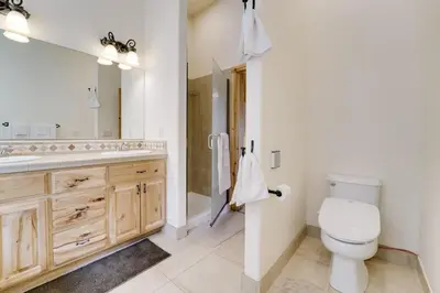 a bathroom with a toilet and a sink at Near Donner Lake and Skiing Soda Springs Cabin! in Soda Springs