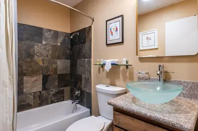 a bathroom with a sink and a tub and a toilet at Mammoth Ski Racquet Club 32 - Newly Remodeled Pet Friendly in Mammoth Lakes