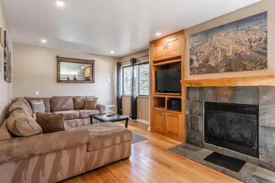 a living room with a couch and a fireplace at Mammoth Ski Racquet Club 32 - Newly Remodeled Pet Friendly in Mammoth Lakes