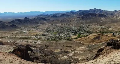 an aerial view of a village in the mountains at El Portal Motel in Beatty