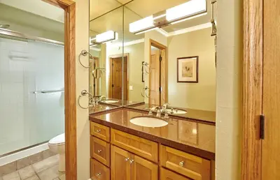 a bathroom with a sink and a mirror at St Anton Street View Ski-In & Out 1-Bedroom Condo in Mammoth Lakes