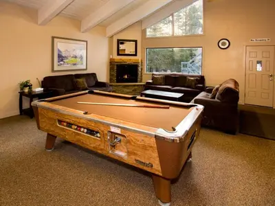 a living room with a pool table in it at St Anton Courtyard View 2-Bedroom Condos with two oversized jacuzzi spas in Mammoth Lakes