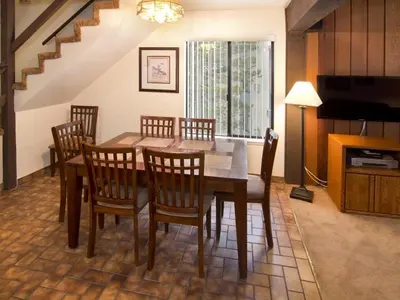 a dining room with a table and chairs at St Anton Street View 2-Bedroom Condo with full kitchen in Mammoth Lakes