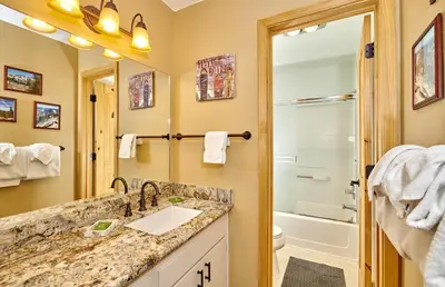 a bathroom with a sink and a toilet and a shower at St Anton Courtyard View 2-Bedroom Condos with Pool & Jacuzzi in Mammoth Lakes