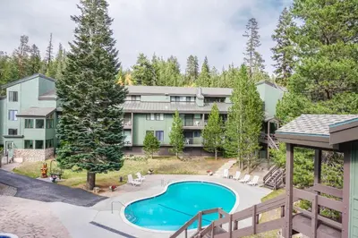 an aerial view of the apartment building with a swimming pool at St Anton Courtyard View 2-Bedroom Condos with Pool & Jacuzzi in Mammoth Lakes