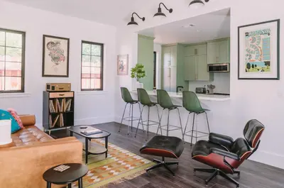 a living room with a couch and chairs and a kitchen at Sacramento Guest House with Patio about 5 Mi to Downtown in Sacramento