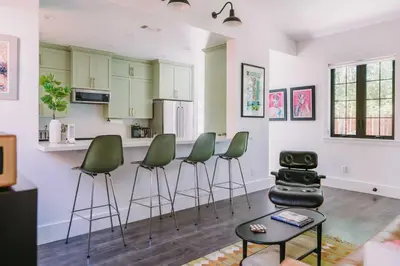 a kitchen with green stools in a living room at Sacramento Guest House with Patio about 5 Mi to Downtown in Sacramento