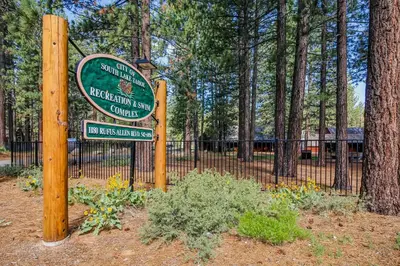 a sign for a park next to a fence at Inntopia in Zephyr Cove