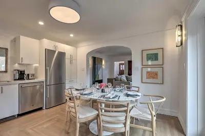 a kitchen and dining room with a table and chairs at Reno Home Less Than 1 Mile to Midtown and Truckee River in Reno