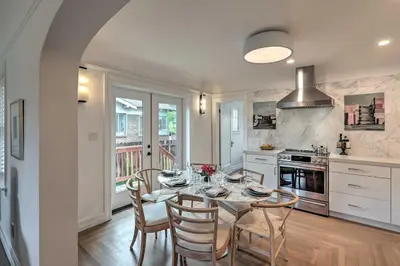 a kitchen with a table and chairs in a kitchen at Reno Home Less Than 1 Mile to Midtown and Truckee River in Reno