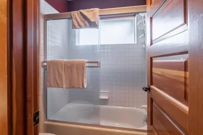 a small bathroom with a tub and a window at Snowcreek V 963 in Mammoth Lakes