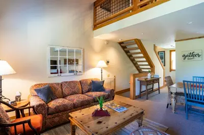 a living room with a couch and a table at Northstar - Gold Bend Getaway in Truckee