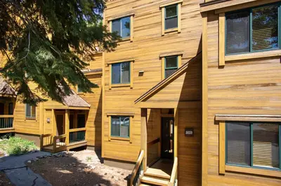 a wooden building with a staircase in front of it at Northstar - Gold Bend Getaway in Truckee