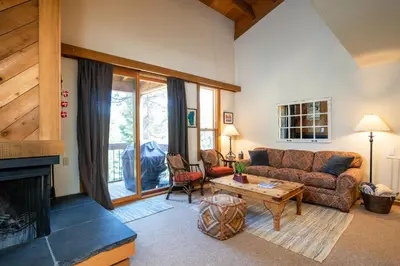 a living room with a couch and a fireplace at Northstar - Gold Bend Getaway in Truckee