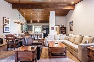 a living room with a couch and a table at Helios 9N in Mammoth Lakes