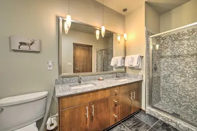 a bathroom with a toilet and a sink and a shower at Modern Mammoth Lakes Condo Ski, Hike, and More! in Mammoth Lakes