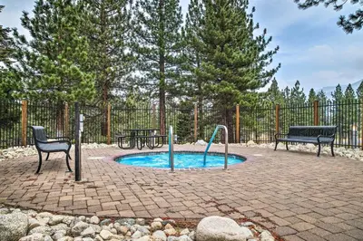 a small pool with a fountain in a patio at Modern Mammoth Lakes Condo Ski, Hike, and More! in Mammoth Lakes