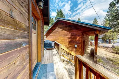 a porch of a wooden house with a roof at Grey Fireplace in Truckee