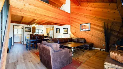 a living room with a couch and a table at Snowflower #20 condo in Mammoth Lakes