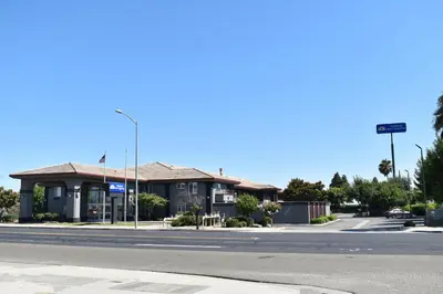 a building on the side of a street at Baymont by Wyndham Manteca in Manteca