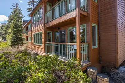 a home with a wrap around porch with windows at Brand New Listing! 5 minute walk to Canyon Lodge! Newly Updated Two-Bed, Two-Bath, Mountainback #14 in Mammoth Lakes