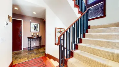 a staircase in a home with a red rug at Juniper Crest #24 townhouse in Mammoth Lakes