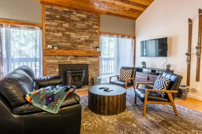 a living room with leather furniture and a fireplace at New Listing Updated 1 Bed and Loft 2 Full Bath La Residence IV N7 Sleeps 4 and Steps to Free Shuttle in Mammoth Lakes