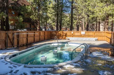 a swimming pool in a yard with snow on the ground at New Listing Updated 1 Bed and Loft 2 Full Bath La Residence IV N7 Sleeps 4 and Steps to Free Shuttle in Mammoth Lakes