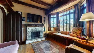 a living room with a couch and a fireplace at Juniper Ridge #16 home in Mammoth Lakes