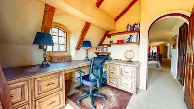 a home office with a desk and a chair at Juniper Ridge #16 home in Mammoth Lakes