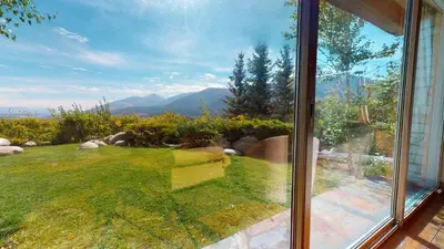 a window of a house with a view of a yard at Juniper Ridge #16 home in Mammoth Lakes