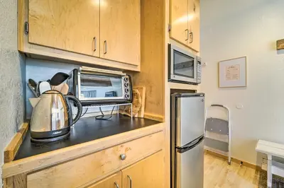 a kitchen with a microwave and a tea kettle at Walk to Ski Resort Tahoe Donner Studio with Balcony in Truckee