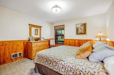 a bedroom with a bed and a dresser at Worth The Waite in Arnold