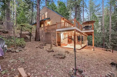 a house in the middle of the forest at Worth The Waite in Arnold