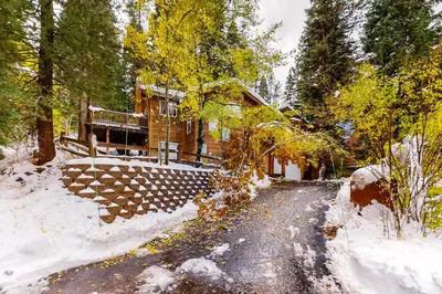a log home in the woods in the snow at Laurelwood Manor in Truckee