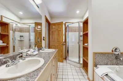 a bathroom with two sinks and a shower at Laurelwood Manor in Truckee