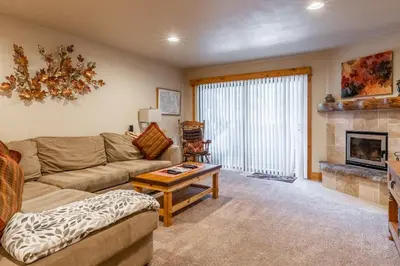 a living room with a couch and a fireplace at New Listing Updated 1 bedrm 1 bath Summit H Building #95 condo Just steps to Eagle Lodge sleeps 4 in Mammoth Lakes