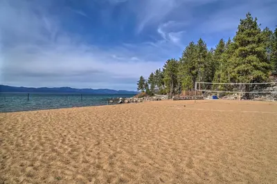 a soccer field on a sandy beach next to the water at Deck and Beach Access Lake Tahoe Shoreside Retreat! in Elk Point