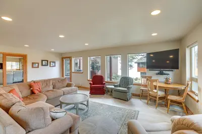 a living room with a couch and a table and chairs at Deck and Beach Access Lake Tahoe Shoreside Retreat! in Elk Point
