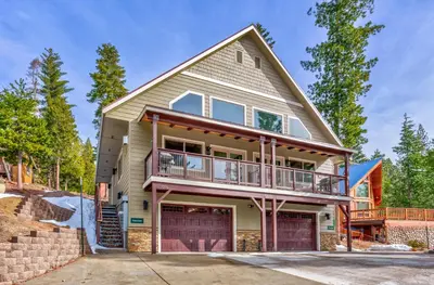 a house with a wrap around porch at Devonshire - Aberdeen in Yosemite West