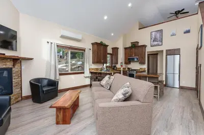 a living room with a couch and a fireplace at Devonshire - Aberdeen in Yosemite West