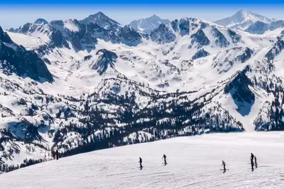 a group of people skiing down a snow covered mountain at Ski Run Villas 8 in Mammoth Lakes