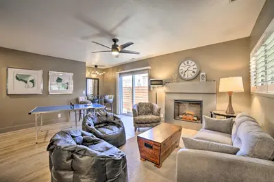 a living room with a couch and a fireplace at Game Room and Putting Green Reno Home! in Reno